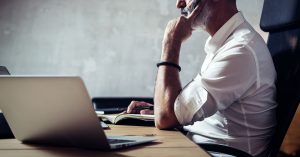 Insurance agent at desk Finding Annuity Lead Companies
