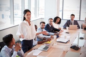 Life Insurance Agency Owner In Conference Room Talking to Insurance Agents on Boosting Efficiency