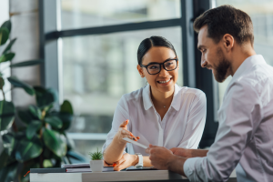 Two Life Insurance Agents Discussing Where to Find Term Life Insurance Leads